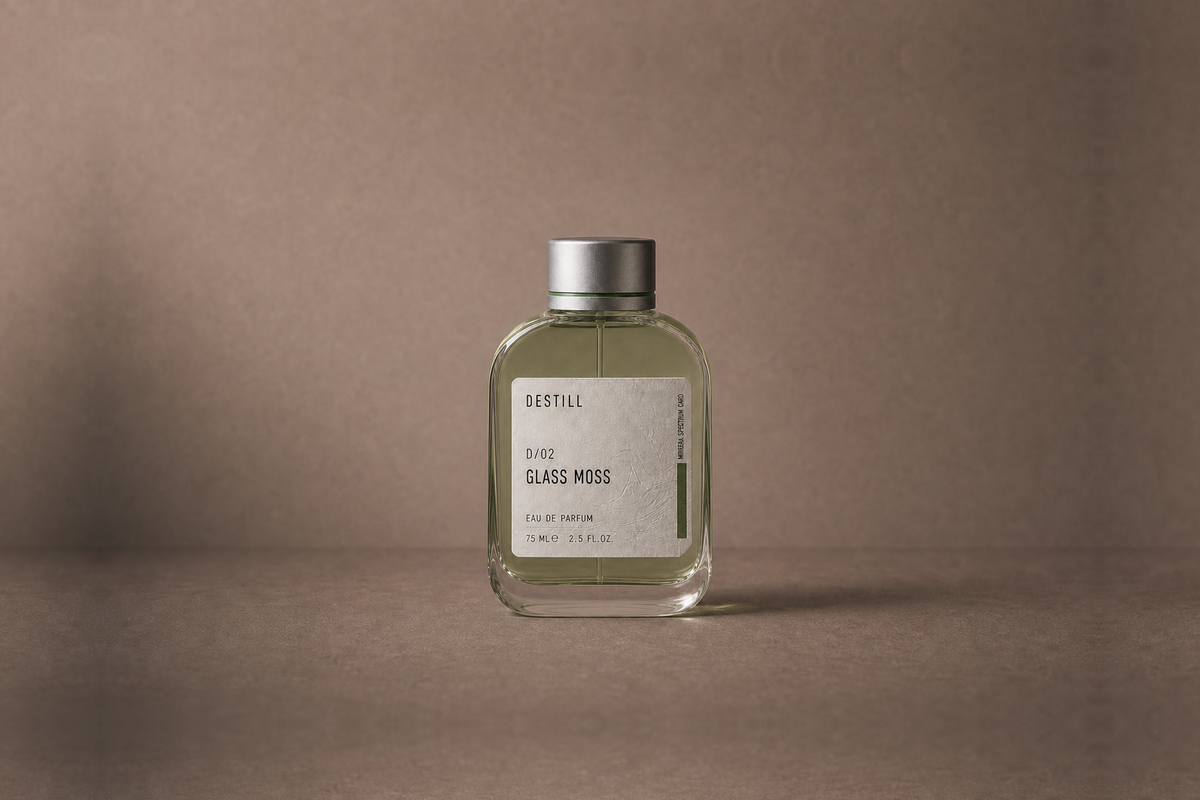 Glass Moss — Eau de Parfum by DESTILL on a dusty mineral clay background