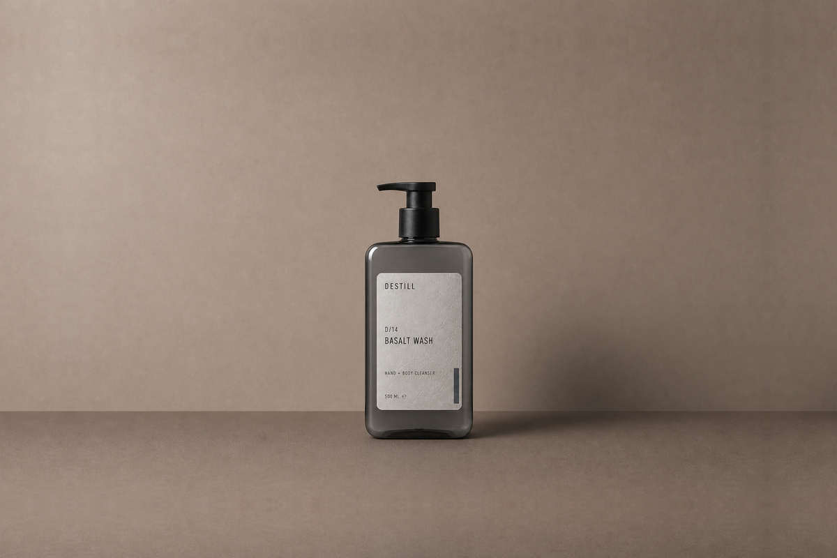 Basalt Wash — Hand & Body Cleanser by DESTILL on a dusty mineral clay background