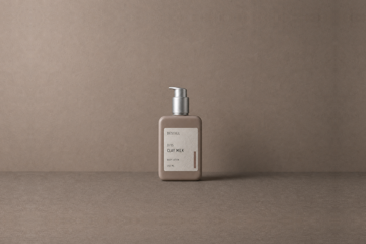 Clay Milk — Body Lotion by DESTILL on a dusty mineral clay background