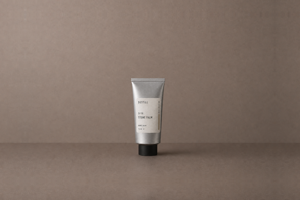 Stone Palm — Hand Balm by DESTILL on a dusty mineral clay background